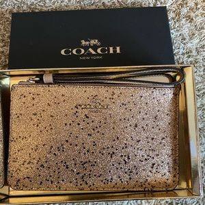New with tags and box Coach larger wristlet.